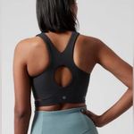 Athleta  NWOT Conscious Cut Out Crop Top D-DD Size M Black Removable Pads Photo 1