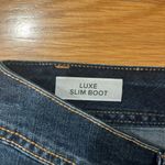 Torrid  women’s luxe slim boot jeans size 12. Photo 2