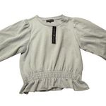 Almost Famous Women’s peplum top Photo 0