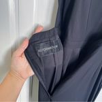 Reformation • black high neck jumpsuit wide leg open back backless strappy Photo 3