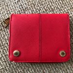 Steve Madden red leather wallet with gold zipper and snap closure, featuring card slots and coin pocket. Photo 0