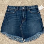 Free People We the Free Bailey blue denim mini skirt raw hem. Photo 0