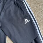 Adidas  Black Sweatpants with Signature Stripes Photo 1