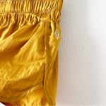 Free People  Movement The Way Home High Waisted Shorts in Gold Photo 3