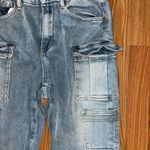 Insane Gene size 9 stretchy jeans. 5 front cargo pockets. Flares. 31 inch inseam Photo 3