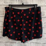 Urban Outfitters Women’s flat front black with red polka dot shorts Medium Photo 1