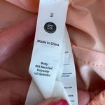 Stori Challenge Shorts and Sports Bra in Cloud Peach White Orange Size undefined Photo 1