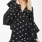 ASOS DESIGN Petite wrap front mini dress in star print Photo 0