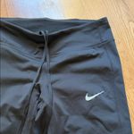 Nike  Black Leggings with White Swoosh Photo 1