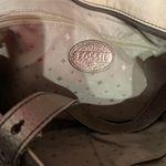 Antique Gold Metallic Pebble Leather Tote Exterior Small Slip Pocket in Back 3 Interior Pockets 1 Zip Zippered Top Closure L 13.75" x W 5" x x H 10.50" Handle Drop 9.5 Photo 2