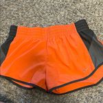 Nike  Orange and Black Athletic Shorts Photo 0