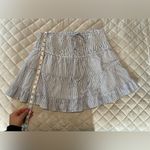 Francesca's Francesca’s Blue and white stripped skirt with gold accents Photo 4
