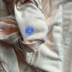 Lululemon size 10 thick Yellow Long Sleeve Top rounded bottom mesh detail EUC Photo 7