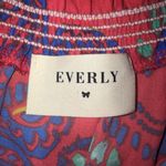 Everly floral red smocked neck romper Photo 2