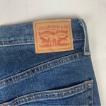 Levi's  size 29 Ribcage bell dark wash denim jeans raw hem flare retro Photo 4