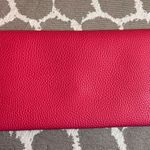 Pink Pebbled Clutch with Playful Tassel Pom Pom Trim Photo 9