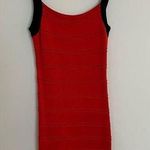 Sexy Black and Orange/Red crisscross back stretch knit dress. Photo 0