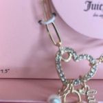 Juicy Couture Gold Charm Bracelet and Heart Locket Earring Set Photo 3
