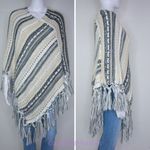 Akira  slanted stripe poncho‎ with fringe edge Photo 1