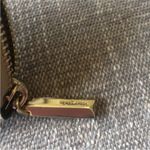 Kate Spade Full Size Gold Glitter Zippered Wallet. Photo 11