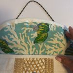 ELSIE…MADE IN THE BAHAMAS WHITE FAUX SKIN CLUTCH WITH STRAW DESIGN SNAP CLOSURE Photo 2