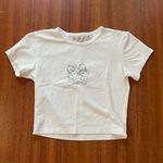 Brandy Melville white cherub graphic crop top Photo 4