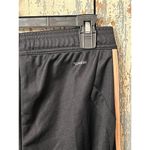 Adidas  track pants size XS black with pink stripe joggers Photo 5