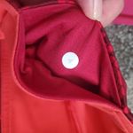 Lululemon  athletica reversible leggings in orange and  red in size 4 Photo 7
