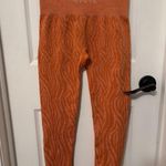NVGTN Burnt Orange Zebra Seamless Leggings size small Photo 1