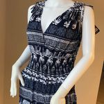 New Women’s dark Navy Blue jumpsuit size L/XL for size 14 New with tags Straps are adjustable Stretchy with front pockets Photo 4