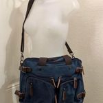 Unisex Y2K Navy blue canvas brown leather messenger crossbody laptop bag multiple cargo pockets zipper closure large interior Measurement in pics Great for school, university, work, streetwear Very spacious, multiple compartments. Can fit most laptop computer, tablets books. Photo 0