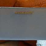 Michael Kors  light blue fold out wallet. Good condition Photo 0