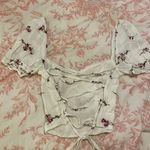 Isabelle's Cabinet Isabelle’s Cabinet Open Back Top Photo 2