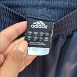 Adidas  Women's Black Joggers with Blue Stripes and Green Logo Photo 1