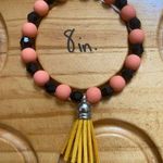 Orange & Black Silicone/Crystal Beaded Bracelet With Tassel Charm Size 8 Inches Photo 1