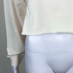 We Wore What  Solid Cropped Sweatshirt in‎ Off White Photo 1