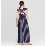Xhilaration NWT Womens Xhiliration Navy Striped Empire Neckline Eyelet Detail Jumpsuit Sz S Photo 1