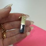 YSL Yves Saint Laurent Gold and Black Charm with Red Detail Photo 2