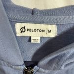 Peloton  hoodie (t-shirt like material) blue with hood and front zip size Medium Photo 5