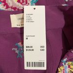 Urban Outfitters NWT! Women’s purple floral tassel wrap mini skirt Medium Photo 3