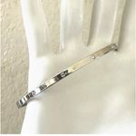 Swavorski Swarovski silver tone thin bangle bracelet Photo 2