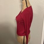 Divided Raspberry colored long sleeve shirt with lace up front. Photo 4