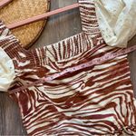 Anthropologie love the label zebra laser cut puff sleeve smocked blouse Photo 7