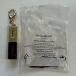 YSL Yves Saint Laurent Gold and Black Charm with Red Detail Photo 0