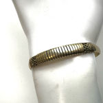 Gold tone etched open cuff bracelet Photo 1