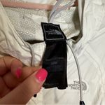 The North Face white wind breaker jacket size medium women’s Photo 3