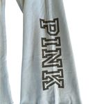 PINK - Victoria's Secret Pink VS Flare Pull On Sweatpants Sz L Blue Drawstring Raw Hem Pink Spell Out Photo 2