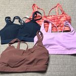 Athleta Lot of 4  sport bras. All size M Photo 0