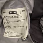 Helly Hansen  medium insulated dark grey snow pants. Adjustable waist and pockets Photo 3