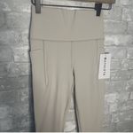 Athleta Salutation Stash Mesh Tight NWT Size XS (Ivory) Photo 1